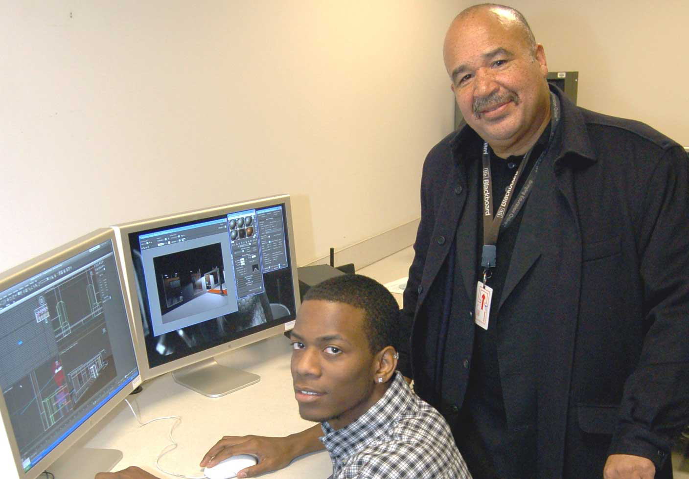 Morgan State University freshman Alexander Johnson is seated in the school&rsquo;s animation room with Digital Media Center Director Keith Mehlinger, (Photo by Daryl Stuart)