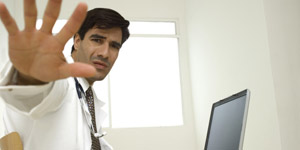 Close-up of a male doctor sticking out his hand