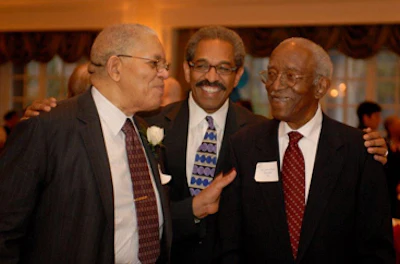 From left, Dr. Samuel DuBois Cook, Dr. Benjamin D. Reese Jr. and Dr. John Hope Franklin share a light moment together.