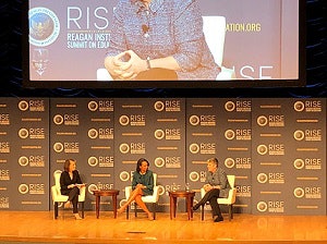 Romy Drucker (left) with panelists Condoleezza Rice and Janet Napolitano.