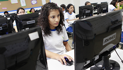 Children participate in a computing class at an Innova school in the outskirts of Lima