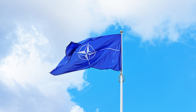 NATO flag waving by wind