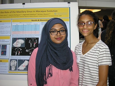 Students presenting their research project at AMNH in New York City.