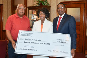 Spencer and Minner Anderson check presentation