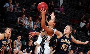 Sheridan Blanford playing basketball while a student at St. Olaf College