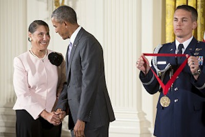 President Barack Obama awards the 2014 National Humanities Medal to Dr. Evelyn Brooks Higginbotham during a ceremony at the White House on Sept. 10, 2015.