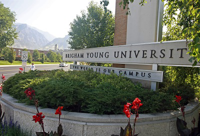 A sign stands at the main entrance to the campus of Brigham