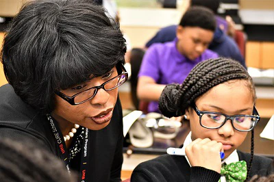 TaShara C. Bailey, Ph.D. works with a student in an anatomy class.