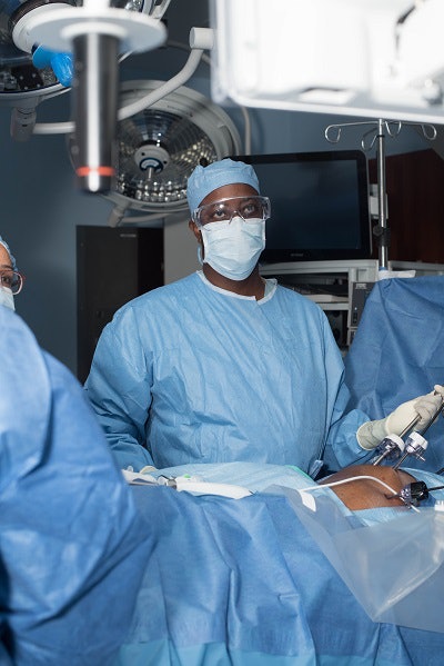 Dr. Wayne A. I. Frederick in the operating room at Howard University Hospital.