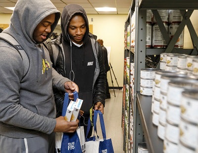 Sharif Coombs (left) and David Medley at a food pantry at Bowie State University. Photo courtesy of Bowie State University.