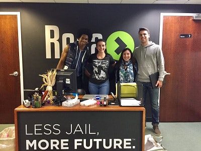 Stephanie Gigliotti, second from left, on a project visit to ROCA, an intervention program for at-risk young men.