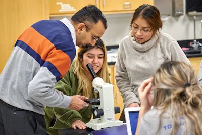 Dr. Niraj Joshi, far left, teaches an anatomy and physiology class at Grand Rapids Community College.