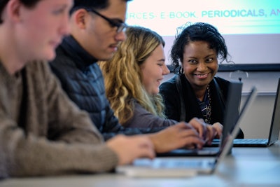 Beverly Shannon, far right, teaches an English class at Grand Rapids Community College.