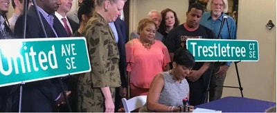 Atlanta Mayor Keisha Lance Bottoms signs a bill changing Confederate street names. (Photo credit: Rosalind Bentley)