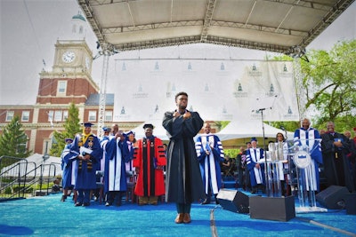 Chadwick Boseman in the Wakanda pose at Howard University’s commencement in 2018. CREDIT: Howard University