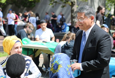 Portland Community College Mark Mitsui chats with students.