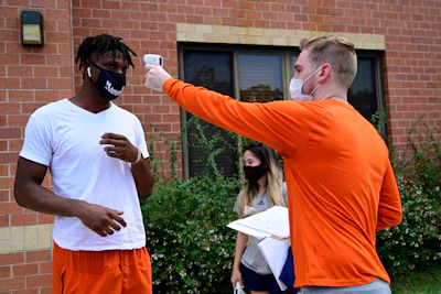 A student’s temperature is checked at Morgan State University.