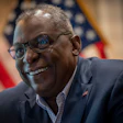 Secretary of Defense Lloyd J. Austin III speaks with service members competing in the 2021 Tokyo Olympics and Paralympics, via video conference in July. (DoD photo by Chad J. McNeeley)