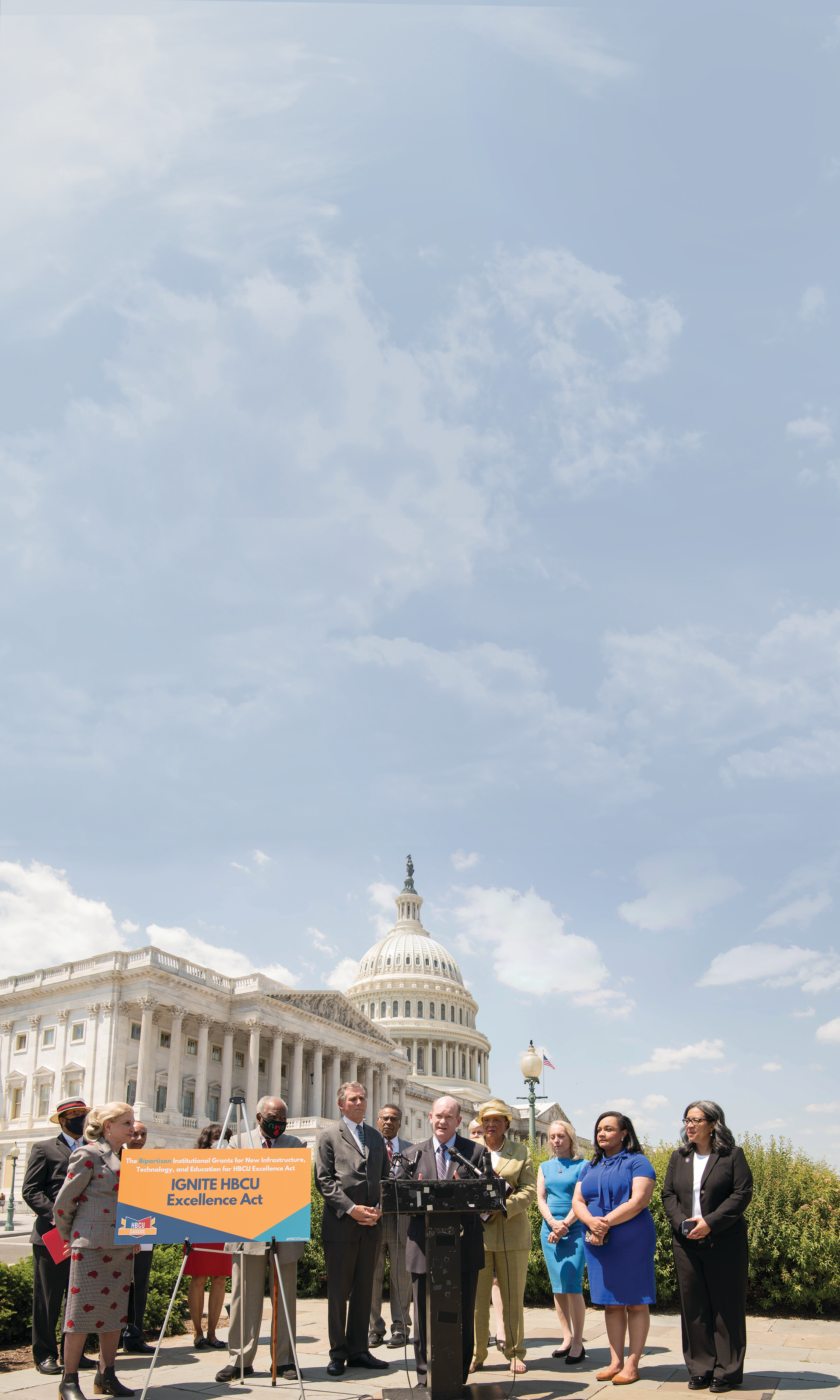 Sen. Chris Coons speaks at the IGNITE announcement in Washington, D.C., with Rep. Alma Adams standing behind him.