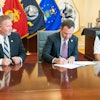 Georgia Southern Vice President for Enrollment Management Scot Lingrell and Vice President for University Advancement Trip Addison and The Landings Military Family Relief Fund Inc. Board of Directors Chairman Bob Longueira sign an agreement for a new scholarship fund designed for spouses of military service members.