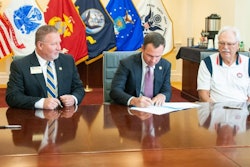 Georgia Southern Vice President for Enrollment Management Scot Lingrell and Vice President for University Advancement Trip Addison and The Landings Military Family Relief Fund Inc. Board of Directors Chairman Bob Longueira sign an agreement for a new scholarship fund designed for spouses of military service members.