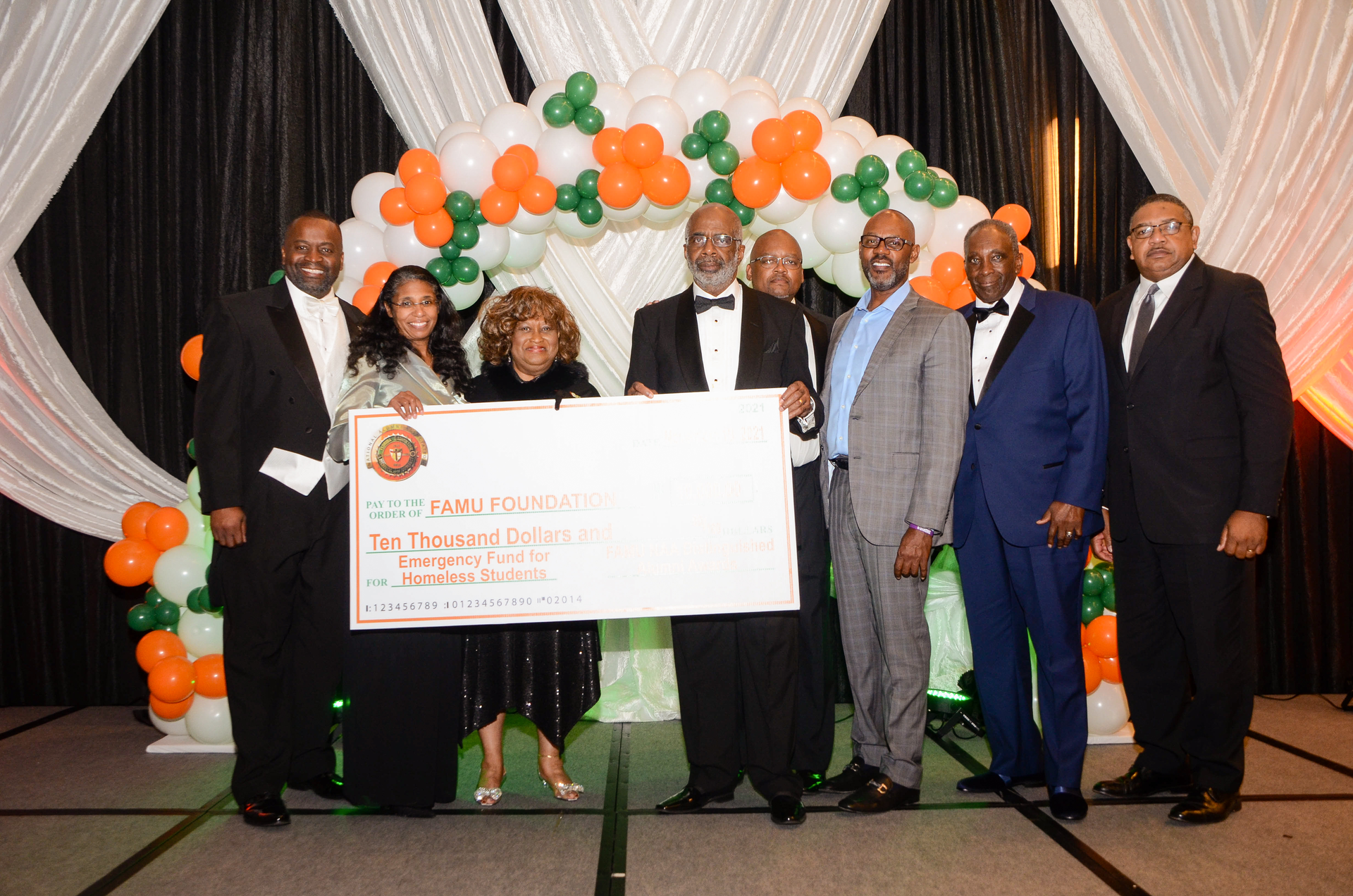 FAMU NAA President Col. Gregory Clark, VP University Advancement Shawnta Friday-Stroud, Ph.D., Event Chair Doris Hicks, President Larry Robinson, Ph.D., VP Student Affairs William E. Hudson, Jr., Ph.D., Jemal Gibson, former NAA President Tommy Mitchell and FAMU BOT Chairman Kelvin Lawson.