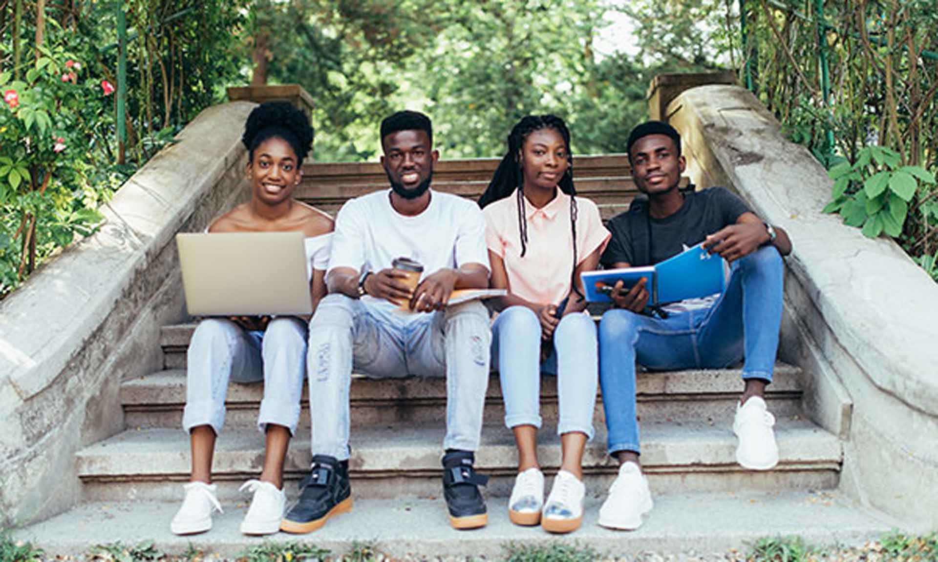Group Of Students On Steps Double