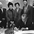 President Lyndon B. Johnson signs the Higher Education Act of 1965