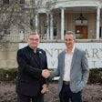 Bruce Murphy, president of Centenary University, left, shakes hands with Dr. Tal Ben-Shahar, right.