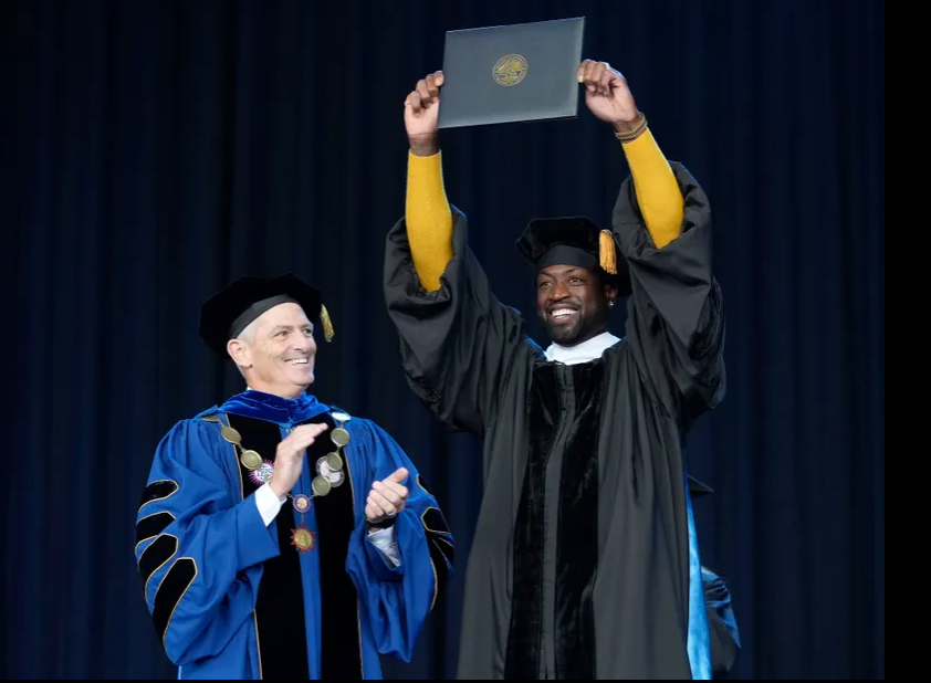 Marquette University President Michael Lovell and Dwyane Wade
