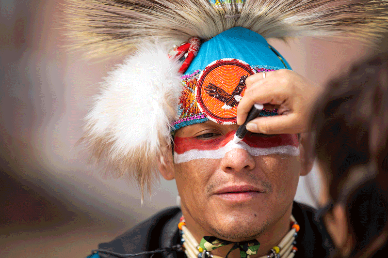 Head Man Brandon Stabler of the Omaha Tribe prepares to dance outside Arts and Sciences Hall for the virtual Wambli Sapa Memorial Pow Wow on campus at the University of Nebraska at Omaha in Omaha, Nebraska, Saturday, March 13, 2021.