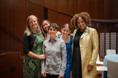 Dr. Janet R. Jakobsen stands with students and other faculty at a BCRW event.