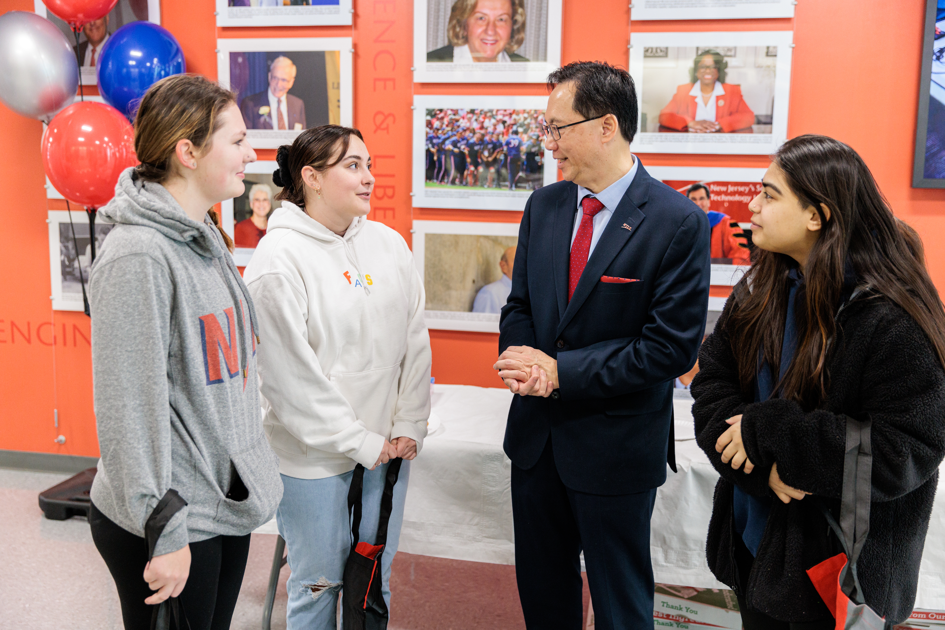 Dr. Teik Lim mingles with students during an event at the New Jersey Institute of Technology.