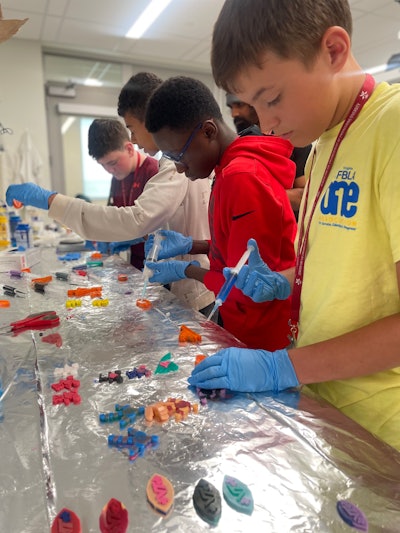 Young people in Virginia Tech's Center for the Enhancement of Engi- neering Diversity take part in pre-college STEM activities.