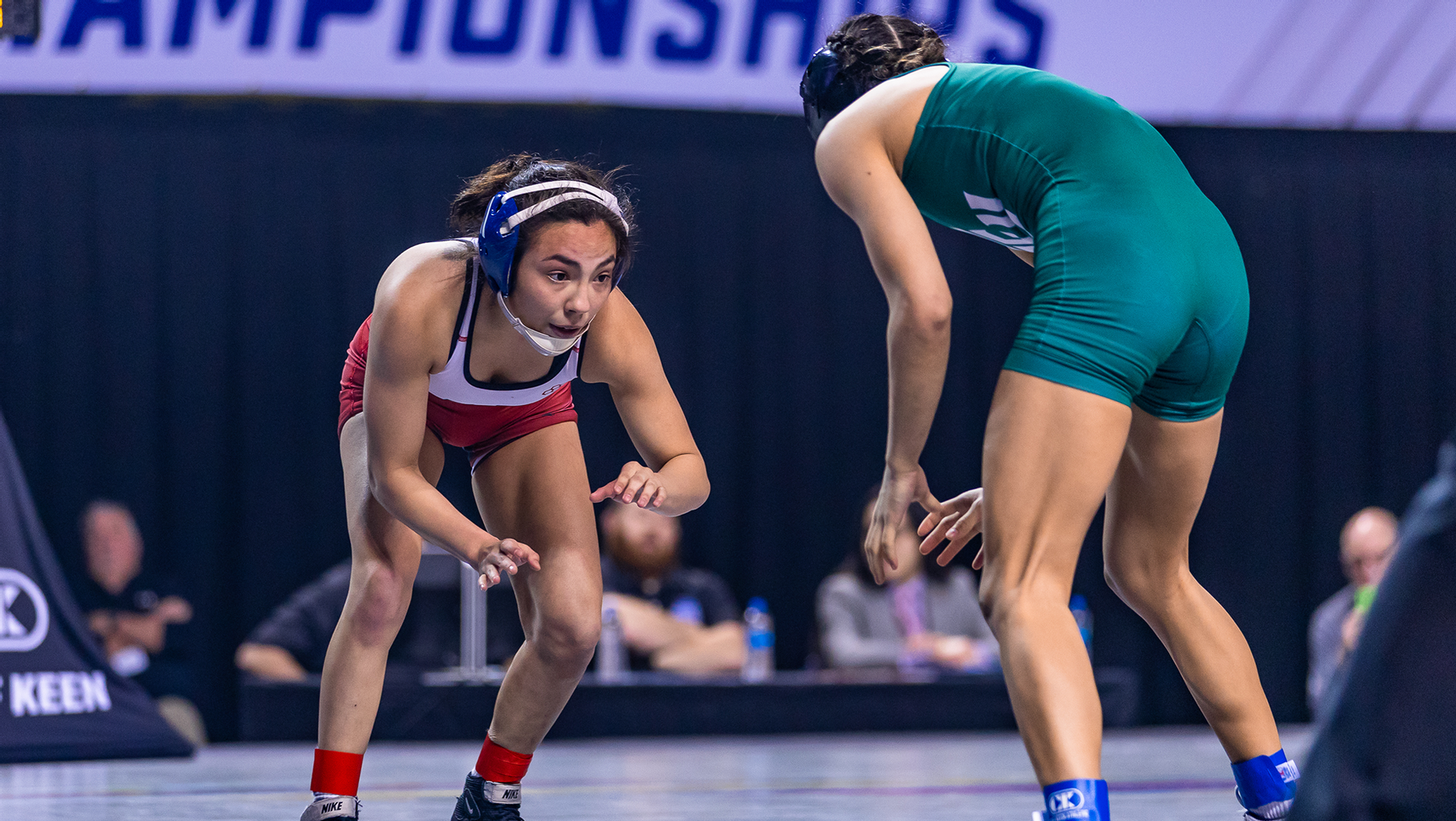 Maddie Avila, left, a women&rsquo;s wrestler at North Central (Illinois), competes in a match during the 2022-23 season.