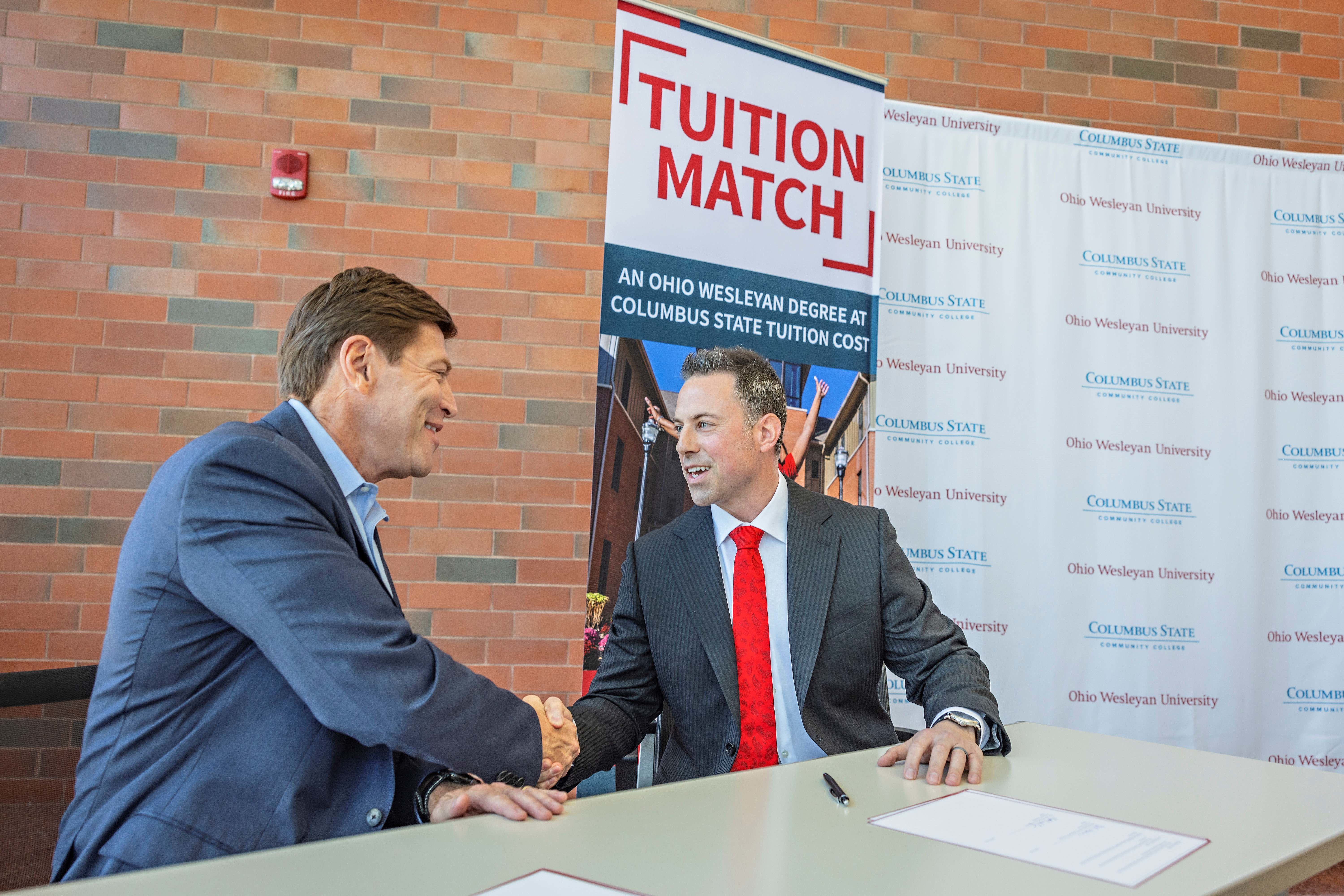 President Dr. David Harrison (left) of Columbus State Community College and President Dr. Matt vandenBerg of Ohio Wesleyan University shake hands after signing a landmark agreement April 18 at Columbus State&rsquo;s Delaware Campus. The agreement improves affordability and accessibility for qualified Columbus State graduates who want to complete their bachelor&rsquo;s degrees at Ohio Wesleyan.