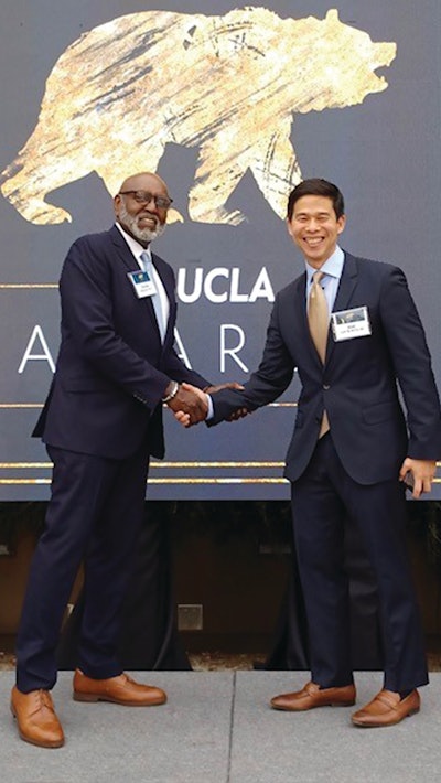 Dr. Charles Alexander is shown with Kiet Lam, president of the AAP alumni network.