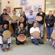Group photo with completed projects at Drum Making Workshop hosted by Ojibwemowining Digital Arts Studio at FDLTCC