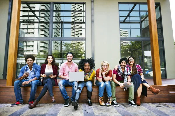 Depositphotos 115687282 Stock Photo College Students Using Wireless Devices
