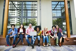 Depositphotos 115687282 Stock Photo College Students Using Wireless Devices