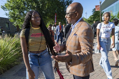 Dr. David K. Wilson speaks to a Morgan State University student.
