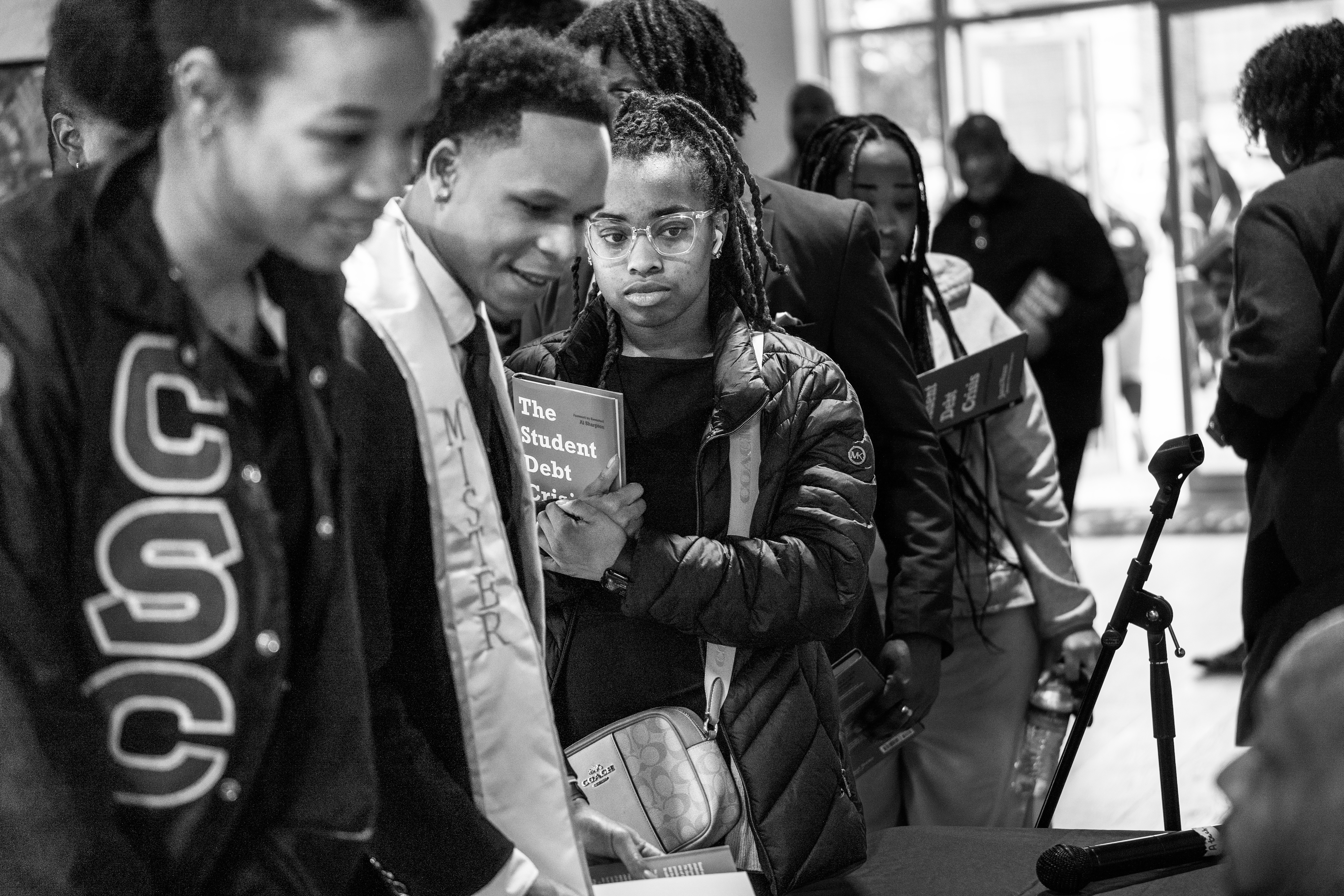 Stillman students wait in line to receive a signed copy of The Student Debt Crisis: America's Moral Urgency.