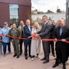 California Gov. Gavin Newsom cuts the ribbon on the new San Quentin Learning Center.