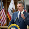 California governor speaking at podium with state seal and American flag in background