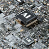 AI microchip processor on circuit board with gold contacts and electronic components