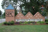 St. Philip's College entrance sign with brick pillars, established 1896, featuring SPC logo and landscaping