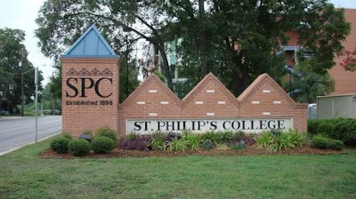 St. Philip's College entrance sign with brick pillars, established 1896, featuring SPC logo and landscaping