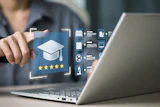 Person pointing at holographic education interface with graduation cap icon and five-star rating on laptop screen